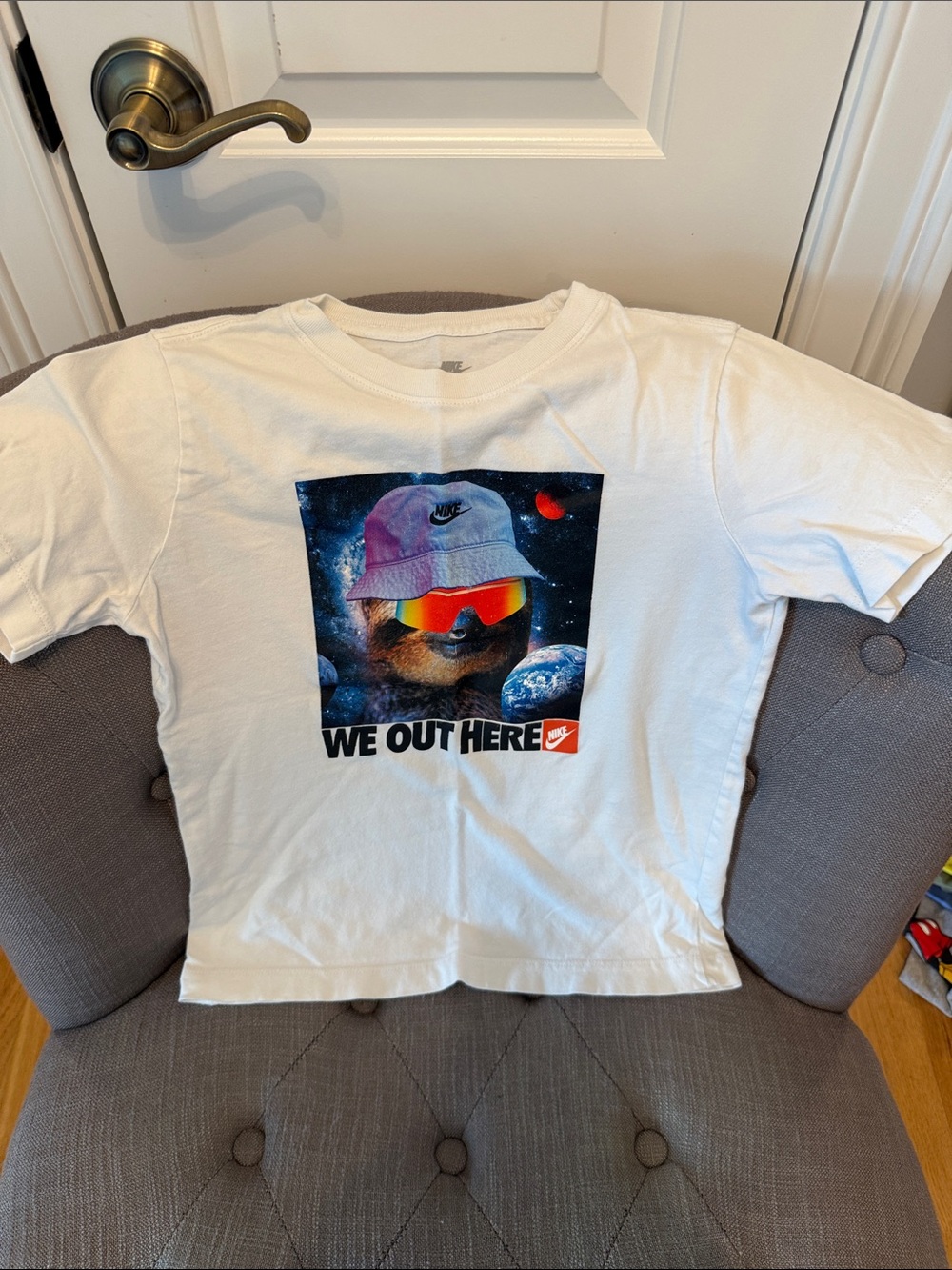 Nike White Kids Graphic 'We Out Here' Tee with Colorful Space Bear